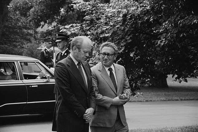 Kissinger and Ford are shown in a black-and-white photo in Assassin's Creed: Brotherhood.