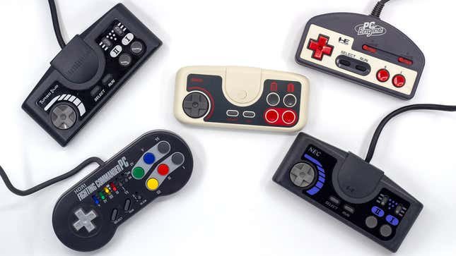 Four vintage PC Engine / TurboGrafx-16 controllers surround a wireless 8BitDo PC Engine gamepad.